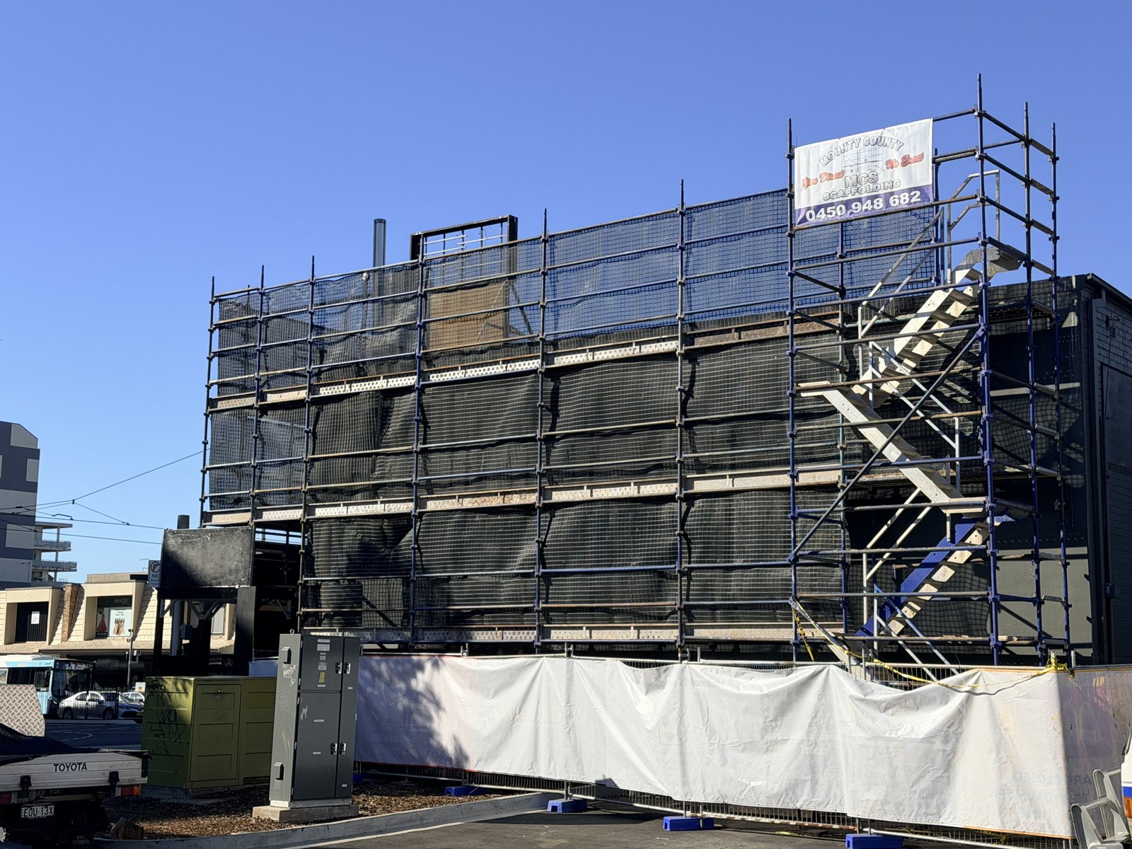 Full-building scaffold and protective wrap
